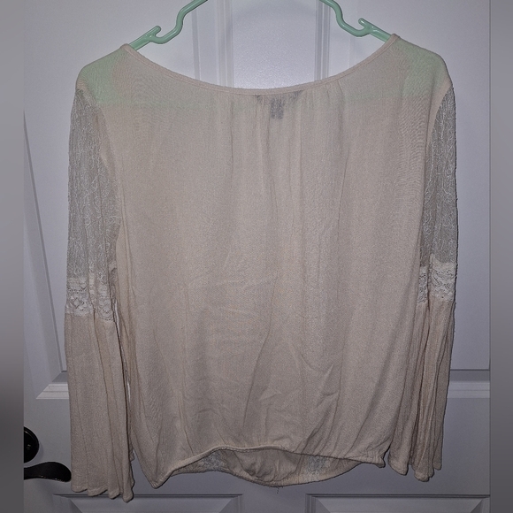 An American Eagle sheer and lace low-cut blouse in a size medium. - Picture 2 of 9